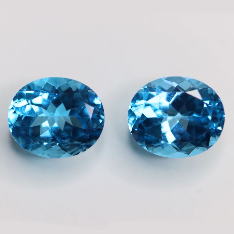 BLUE TOPAZ SWISS 12X10 FACETED OVAL PAIR