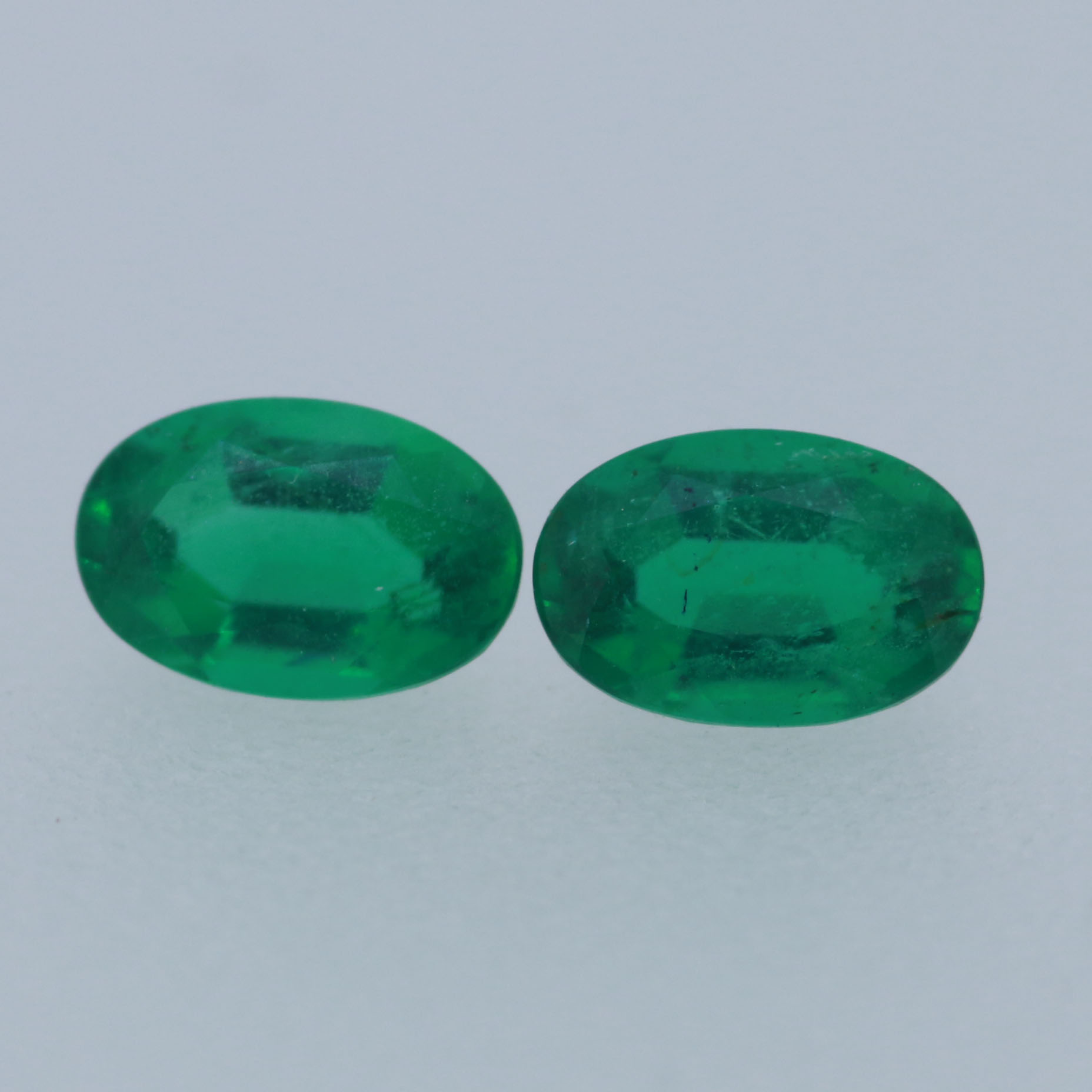 EMERALD PAIR 6X4 OVAL 0.84CT