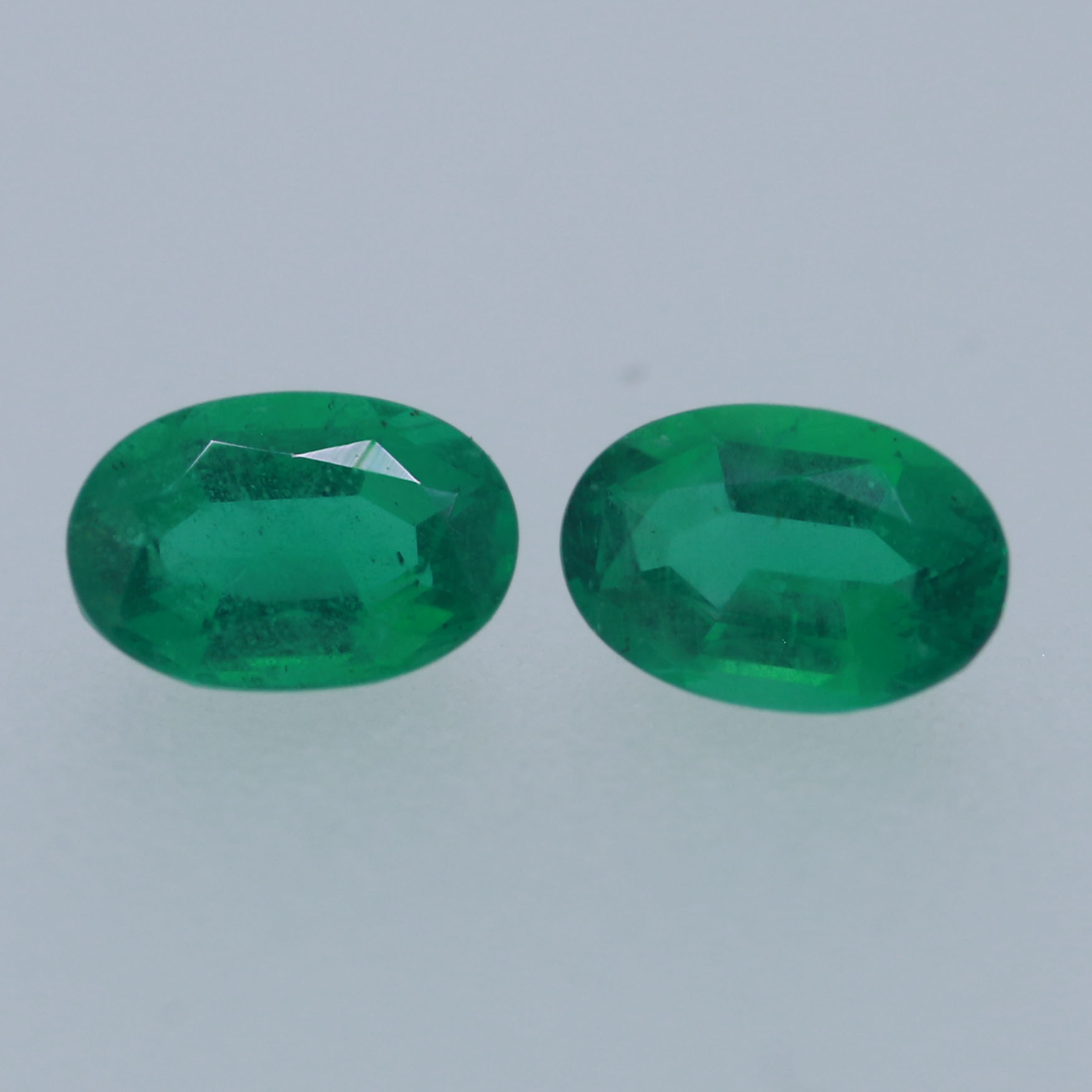 EMERALD PAIR 6X4 OVAL 0.78CT