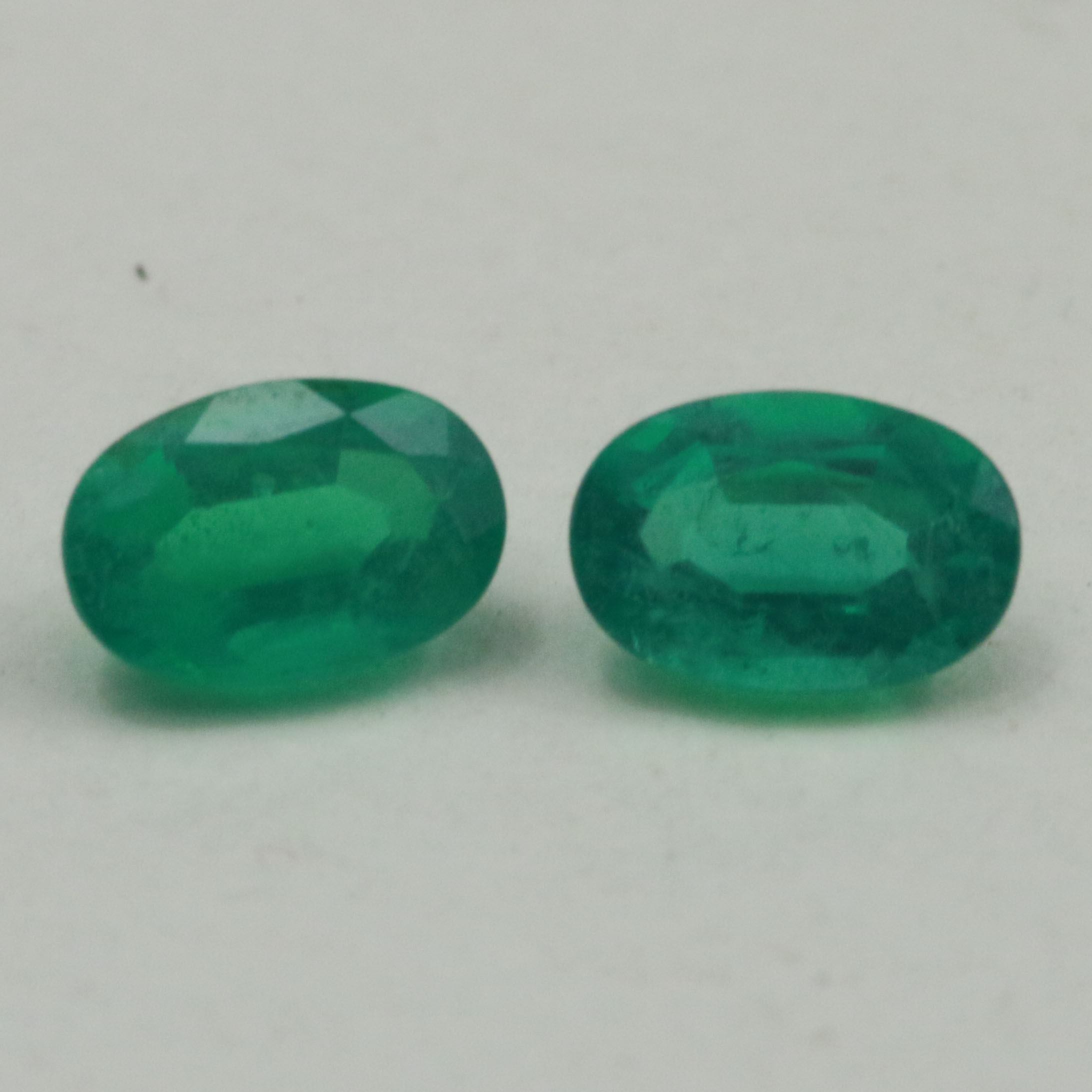 EMERALD PAIR 5.9X4 OVAL 0.83CT