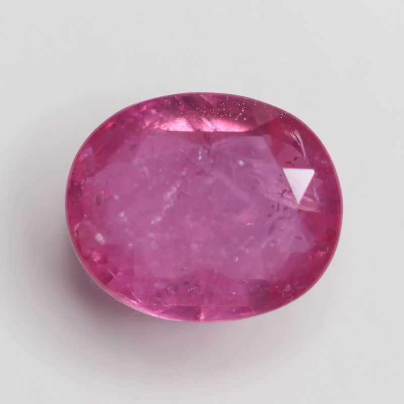 GLASS FILLED RUBY 12X10 OVAL FACETED