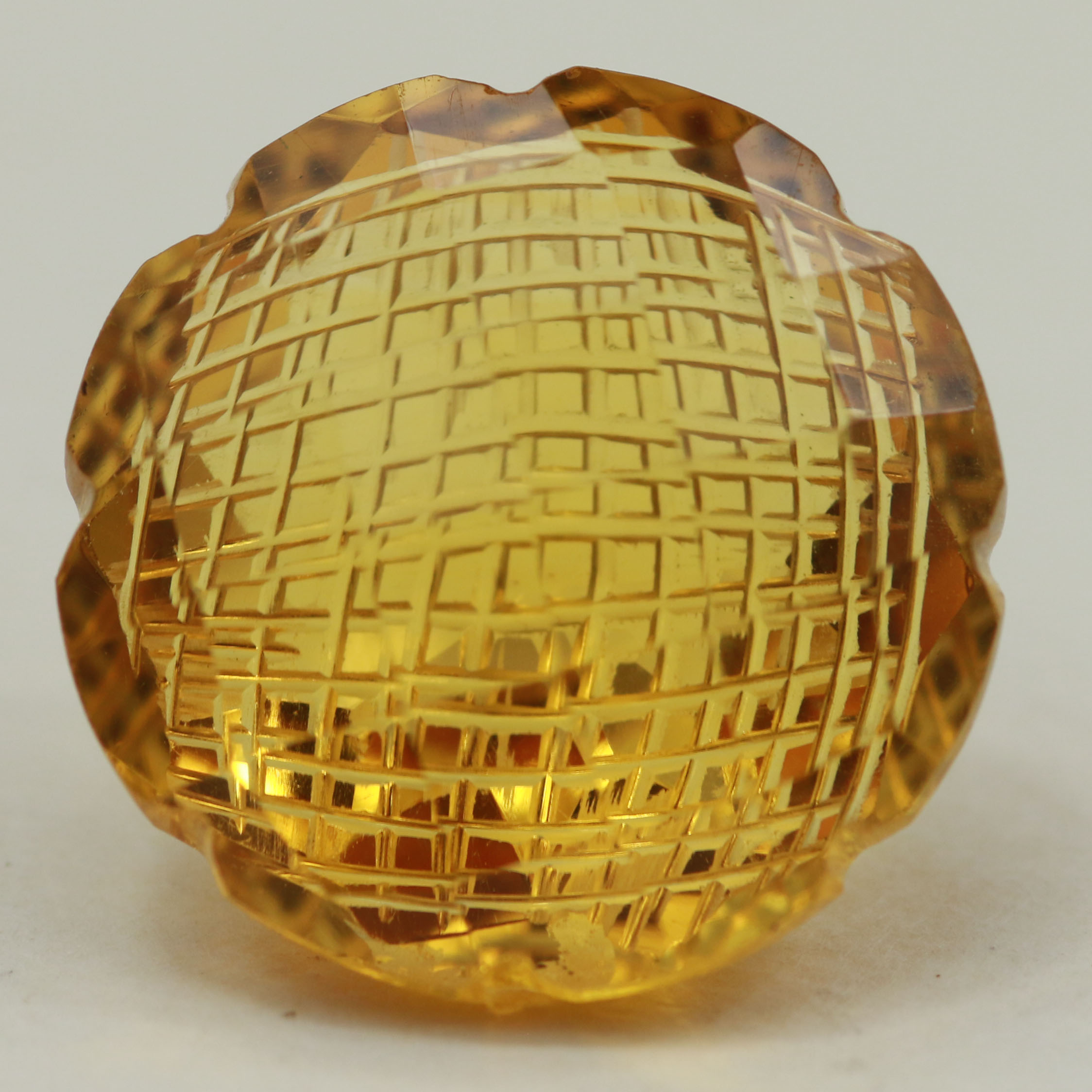 SYNTHETIC CITRINE 18MM FANCY CARVED ROUND