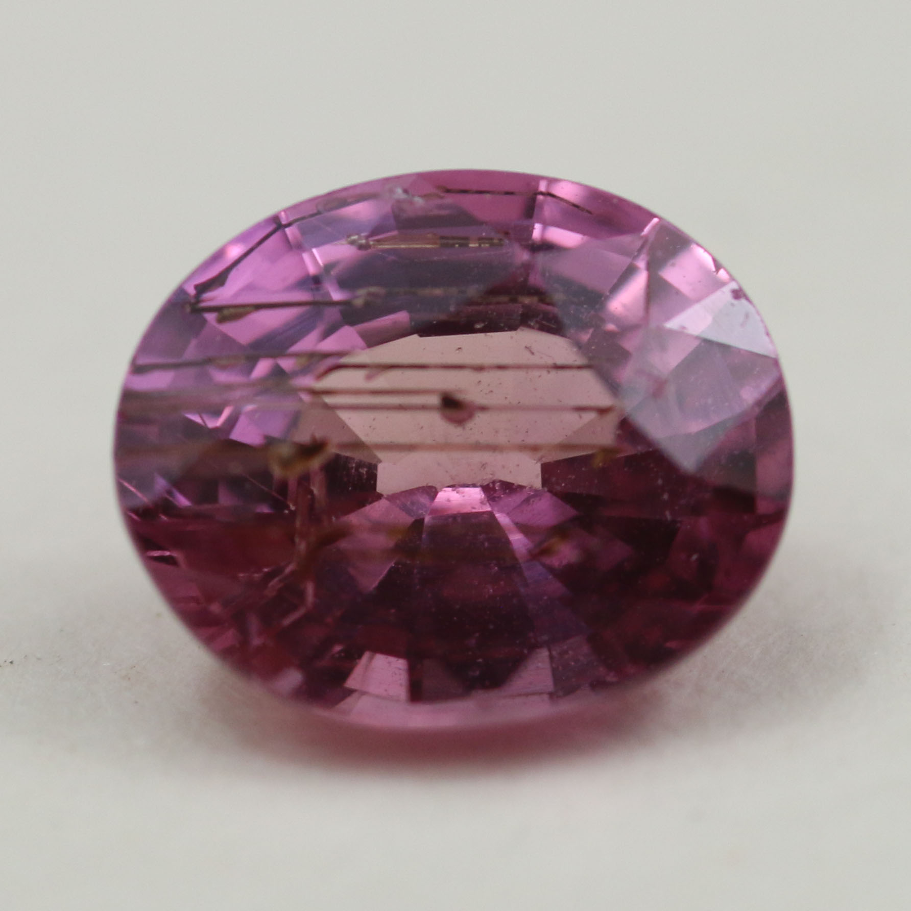 PINK SAPPHIRE WITH RUTILE NEEDLES 7.4X6.1 OVAL